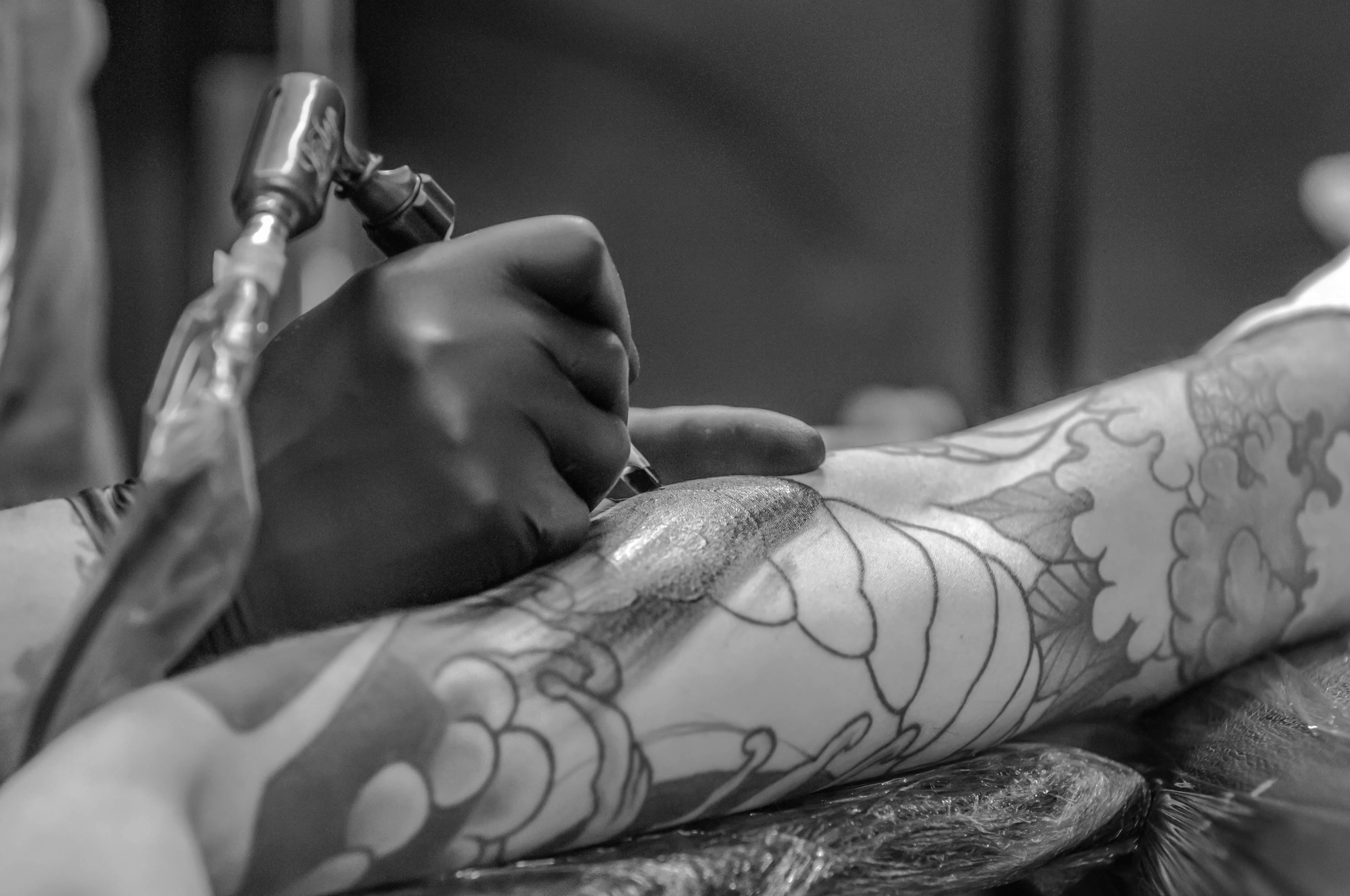 Arm being tattooed