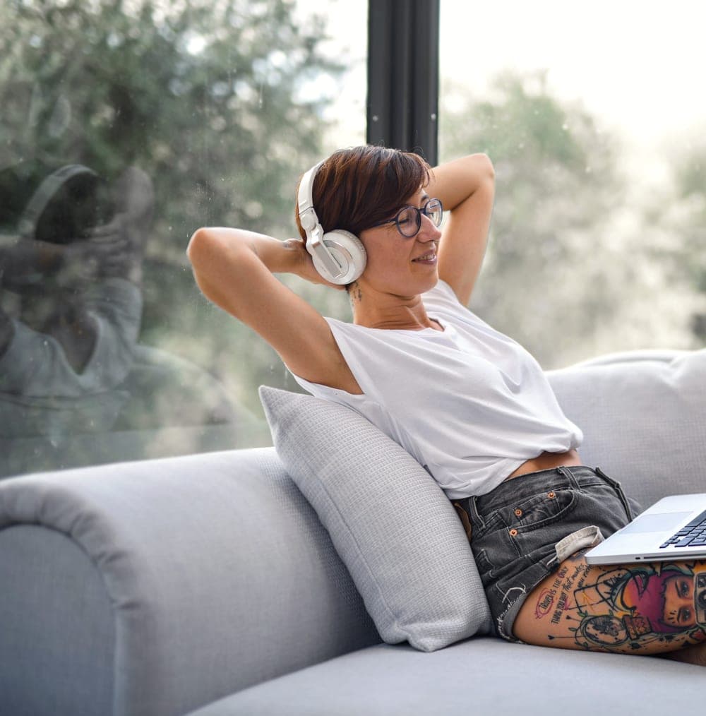 Tattoo artist relaxing on a couch