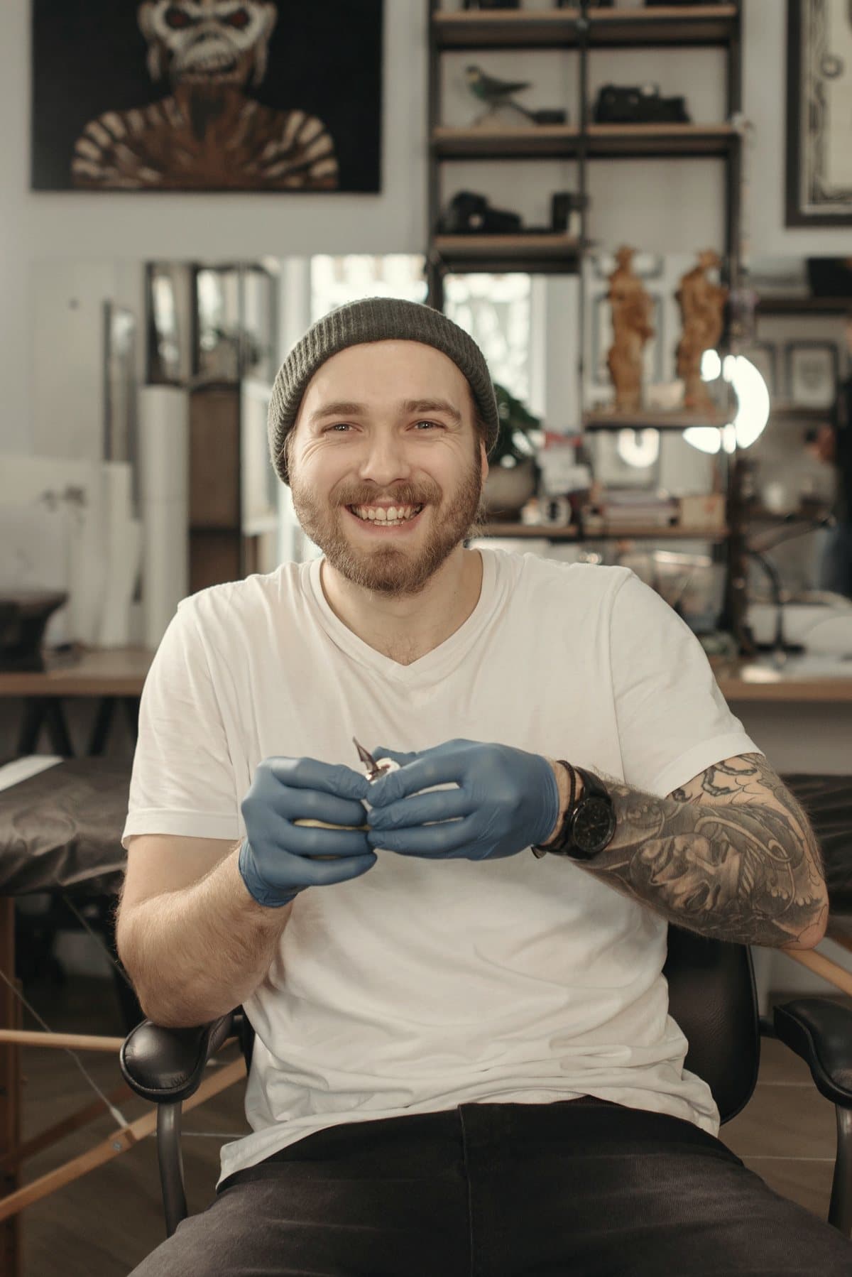 Tattoo artist in gloves at their station